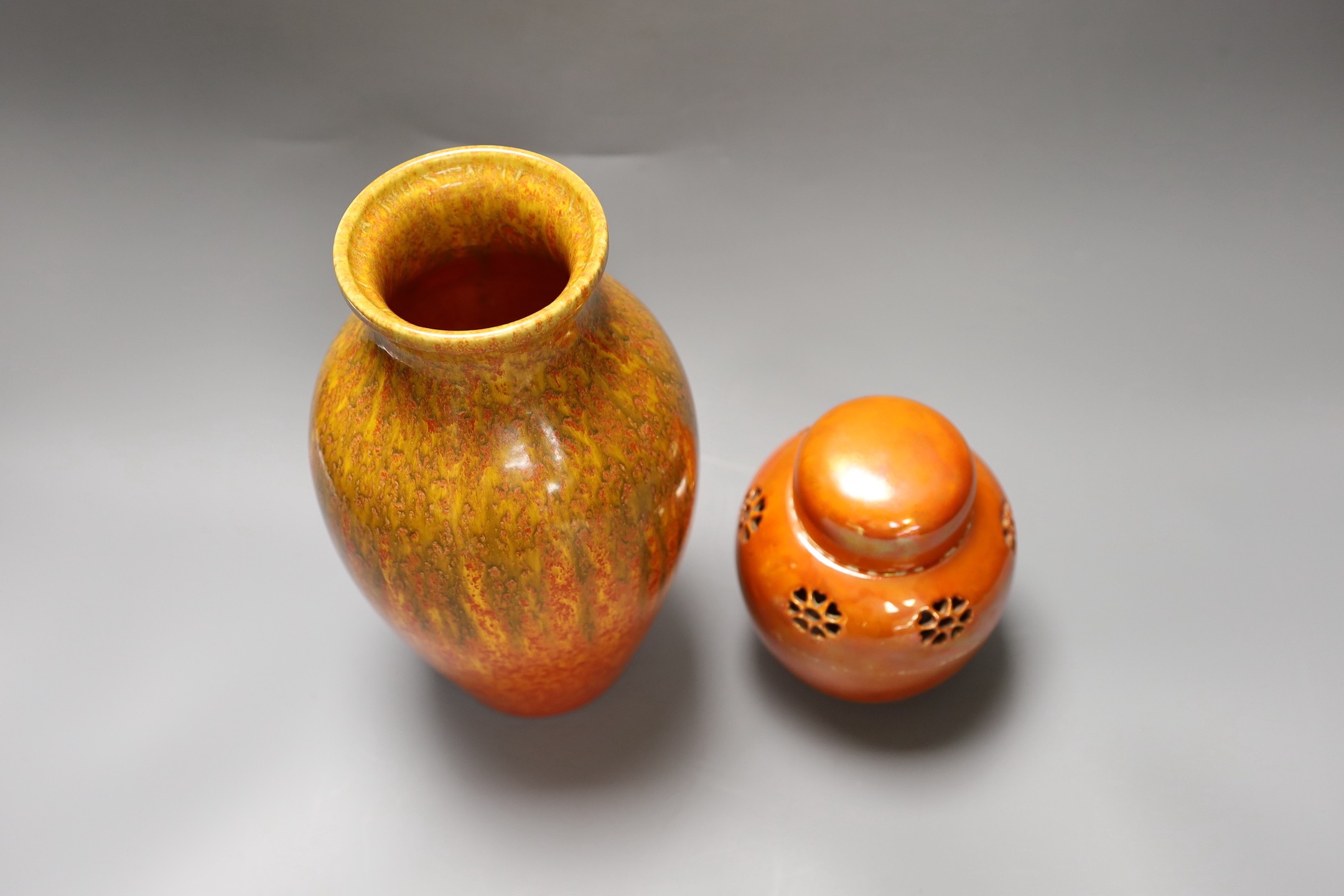 A Pilkington‘s Royal Lancastrian mottled orange ground vase and a Ruskin Orange lustre jar and cover, dated 1914, tallest 25cm